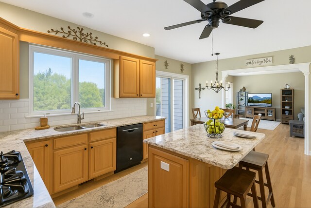 7N310 Ridge Line Rd, Saint Charles, IL 60175 - kitchen featuring black appliances, a sink, a breakfast bar, decorative backsplash, and recessed lighting