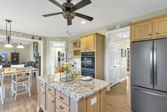 7N310 Ridge Line Rd, Saint Charles, IL 60175 - kitchen with freestanding refrigerator, light brown cabinets, light wood finished floors, recessed lighting, and light stone countertops