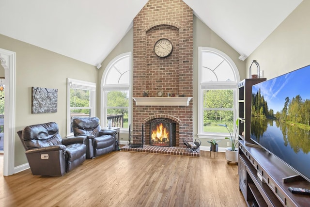 7N310 Ridge Line Rd, Saint Charles, IL 60175 - living area with high vaulted ceiling, wood finished floors, a brick fireplace, and baseboards