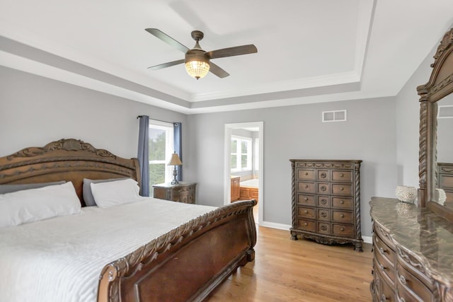 7N310 Ridge Line Rd, Saint Charles, IL 60175 - bedroom featuring a raised ceiling, light wood-style floors, ceiling fan, and ensuite bath