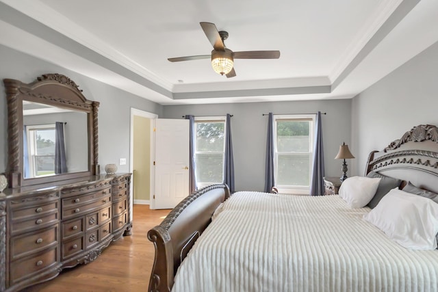 7N310 Ridge Line Rd, Saint Charles, IL 60175 - bedroom featuring a tray ceiling, light wood-style flooring, crown molding, and a ceiling fan