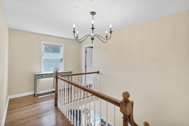 7N310 Ridge Line Rd, Saint Charles, IL 60175 - corridor featuring an upstairs landing, a chandelier, wood finished floors, and baseboards