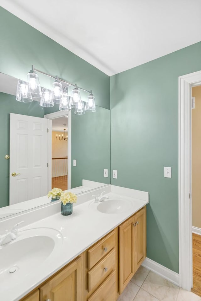 7N310 Ridge Line Rd, Saint Charles, IL 60175 - bathroom with double vanity, a chandelier, and baseboards