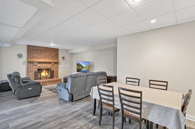 7N310 Ridge Line Rd, Saint Charles, IL 60175 - dining room with a drop ceiling, wood finished floors, recessed lighting, and a brick fireplace