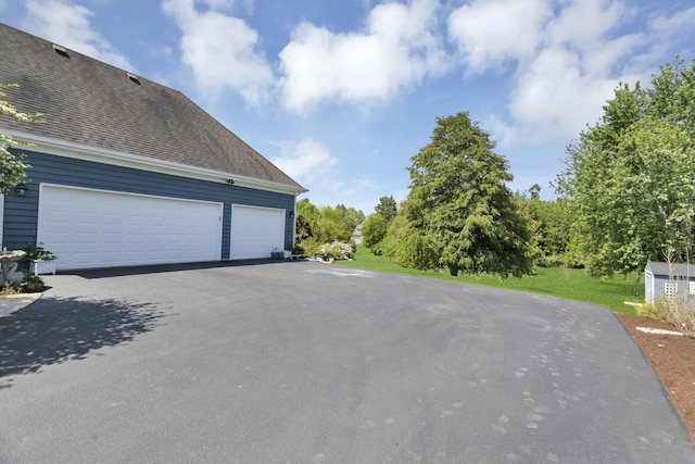 7N310 Ridge Line Rd, Saint Charles, IL 60175 - view of home's exterior with asphalt driveway, a garage, and roof with shingles