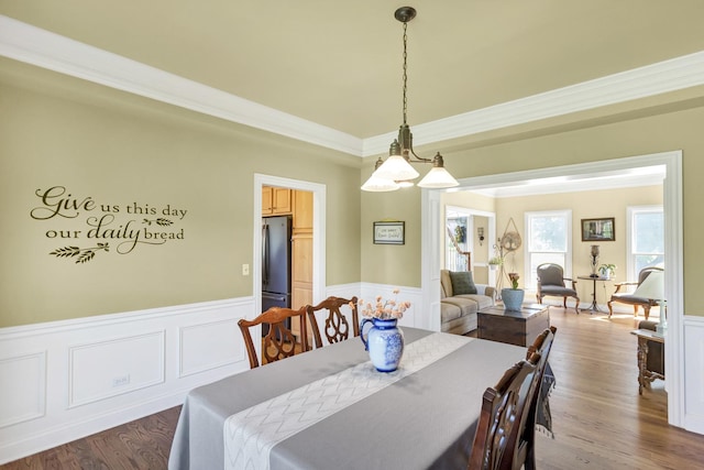 7N310 Ridge Line Rd, Saint Charles, IL 60175 - dining space featuring wainscoting, crown molding, wood finished floors, and a decorative wall