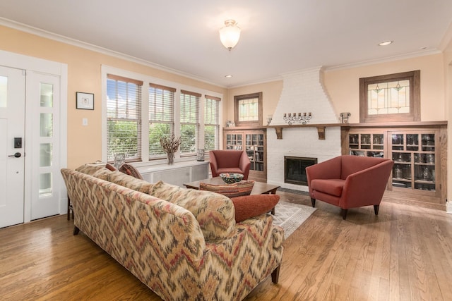 740 Wisner St, Park Ridge, IL 60068 - living room featuring wood finished floors, crown molding, a brick fireplace, and recessed lighting