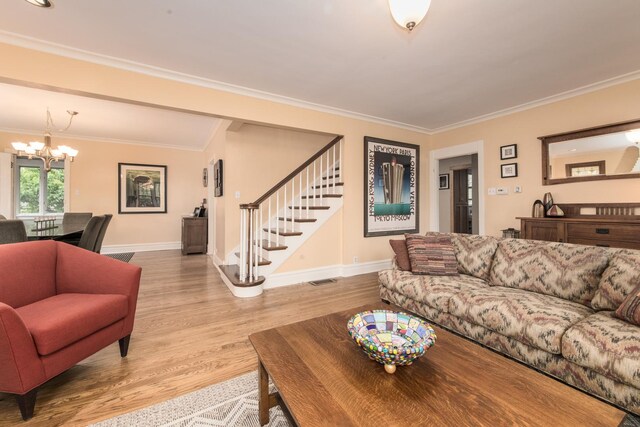 740 Wisner St, Park Ridge, IL 60068 - living area with a chandelier, stairway, ornamental molding, baseboards, and wood finished floors