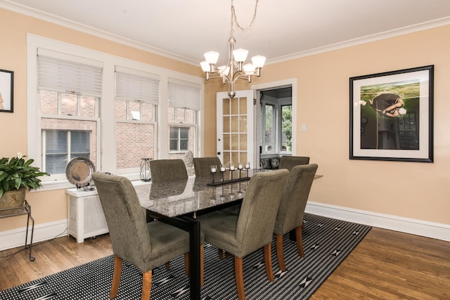740 Wisner St, Park Ridge, IL 60068 - dining space featuring wood finished floors, a chandelier, baseboards, and crown molding