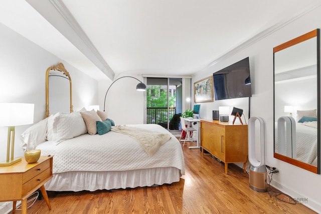 201 E Chestnut St Unit 3C, Chicago, IL 60611 - bedroom with wood finished floors, crown molding, and access to outside