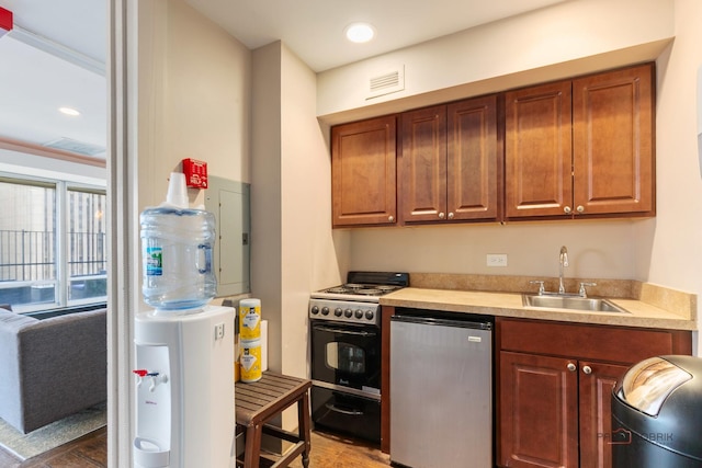 201 E Chestnut St Unit 3C, Chicago, IL 60611 - kitchen with a sink, gas stove, light countertops, dishwashing machine, and recessed lighting