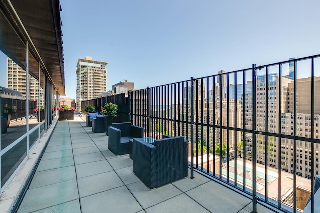 201 E Chestnut St Unit 3C, Chicago, IL 60611 - view of patio with a balcony, a view of city, and an outdoor hangout area