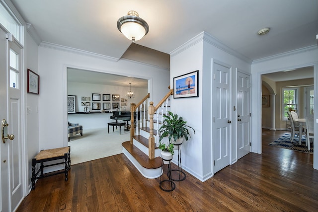 5234 Cedar Ct, Lisle, IL 60532 - entryway with a chandelier, wood finished floors, stairs, crown molding, and arched walkways