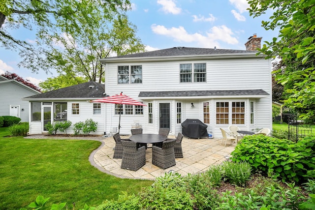 5234 Cedar Ct, Lisle, IL 60532 - rear view of house featuring a patio area, a chimney, a lawn, and a shingled roof