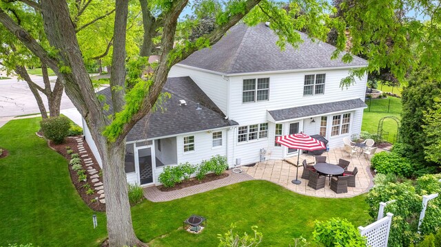 5234 Cedar Ct, Lisle, IL 60532 - rear view of house featuring a shingled roof, a patio area, and a chimney