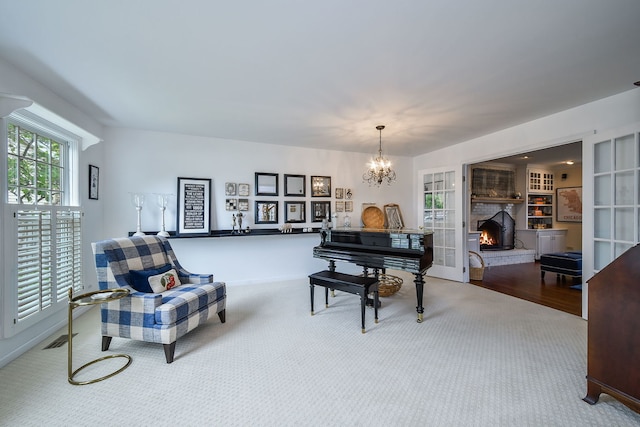 5234 Cedar Ct, Lisle, IL 60532 - living area featuring a lit fireplace, a chandelier, carpet floors, and baseboards