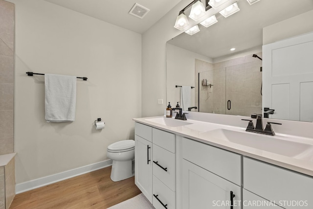 165 Canterbury Way, Lake Zurich, IL 60047 - full bath with double vanity, a shower stall, wood finished floors, and recessed lighting
