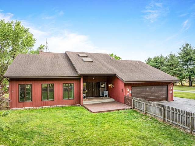 9104 E Weber Rd, Ridott, IL 61067 - rear view of house with a garage, a shingled roof, and driveway