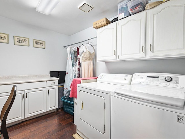 9104 E Weber Rd, Ridott, IL 61067 - laundry room featuring independent washer and dryer, cabinet space, and dark wood-style flooring