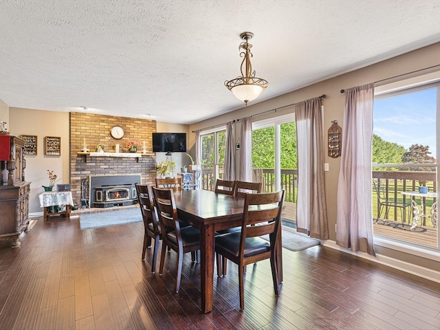 9104 E Weber Rd, Ridott, IL 61067 - dining room with a textured ceiling, dark wood finished floors, and baseboards