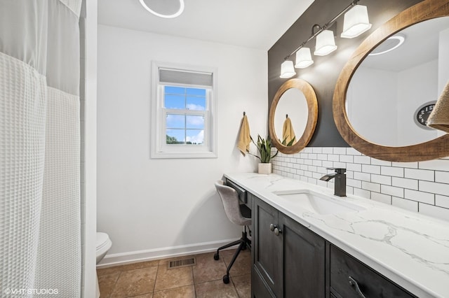 1250 Fernleaf Dr, Crystal Lake, IL 60014 - full bathroom with decorative backsplash, vanity, baseboards, toilet, and a shower with shower curtain