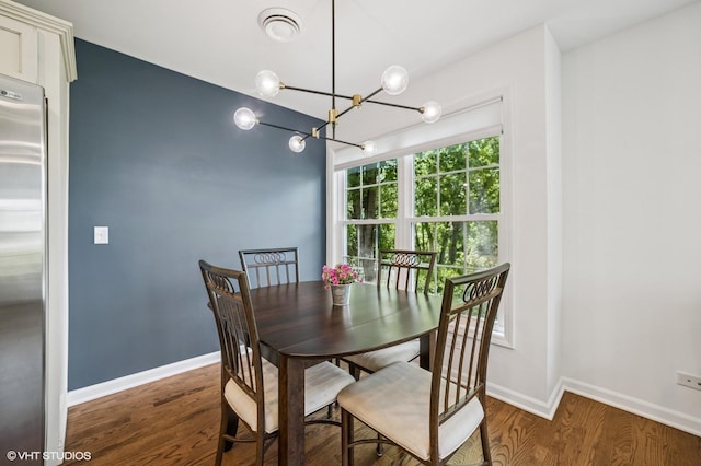 1250 Fernleaf Dr, Crystal Lake, IL 60014 - dining room featuring a chandelier, wood finished floors, and baseboards