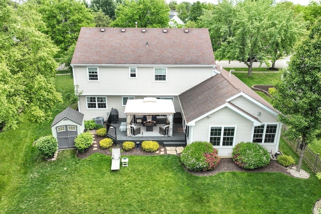 1250 Fernleaf Dr, Crystal Lake, IL 60014 - rear view of house with a gazebo, a wooden deck, an outdoor hangout area, central AC unit, and roof with shingles