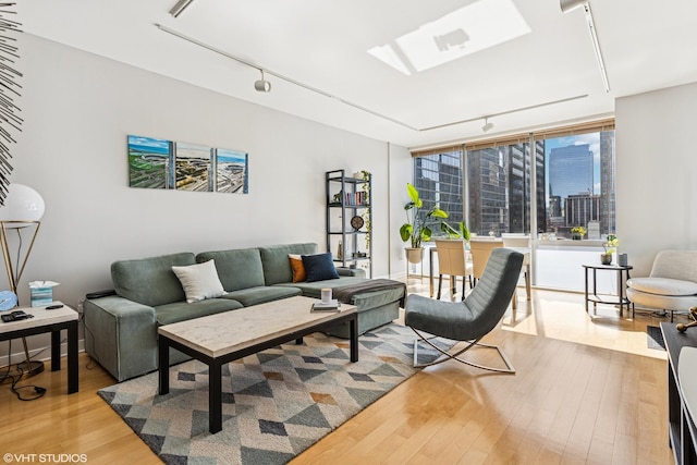 8 E Randolph St Unit 2407, Chicago, IL 60601 - living room featuring track lighting, wood finished floors, and a skylight
