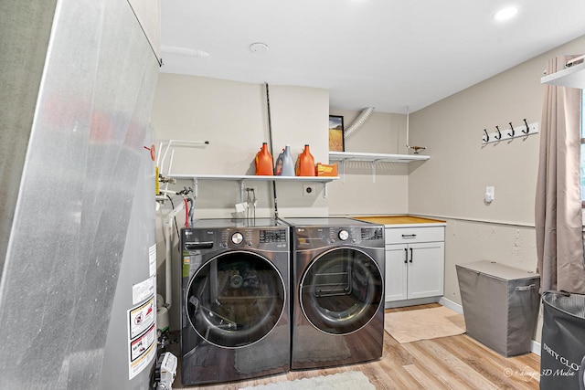 384 Glen Farm Ln, Lake Zurich, IL 60047 - laundry room with cabinet space, light wood-type flooring, and washer and clothes dryer