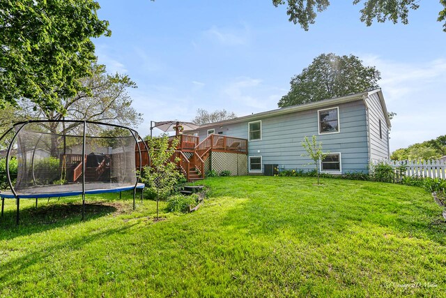 384 Glen Farm Ln, Lake Zurich, IL 60047 - rear view of property featuring a trampoline, a wooden deck, and stairs