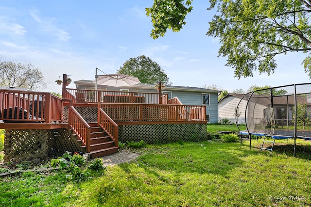 384 Glen Farm Ln, Lake Zurich, IL 60047 - rear view of house featuring a trampoline, a yard, a wooden deck, and stairway