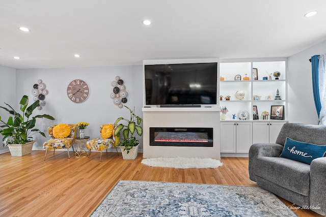 384 Glen Farm Ln, Lake Zurich, IL 60047 - living area featuring wood finished floors, recessed lighting, and a glass covered fireplace