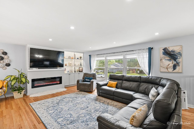 384 Glen Farm Ln, Lake Zurich, IL 60047 - living room with a glass covered fireplace, light wood-style floors, and recessed lighting
