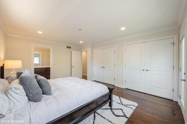 803 Pine St, Deerfield, IL 60015 - bedroom featuring multiple closets, dark wood-style flooring, ornamental molding, recessed lighting, and ensuite bathroom