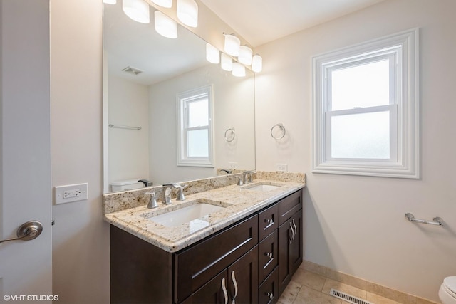 803 Pine St, Deerfield, IL 60015 - full bathroom with toilet, double vanity, baseboards, and tile patterned flooring