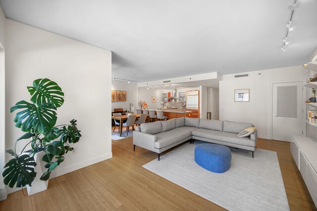 340 E Randolph St Unit 1304, Chicago, IL 60601 - living room with track lighting, wood finished floors, and baseboards