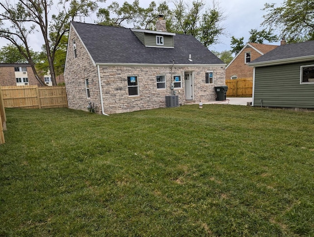 22521 Richton Square Rd, Richton Park, IL 60471 - back of property featuring stone siding, a chimney, a shingled roof, a patio area, and cooling unit