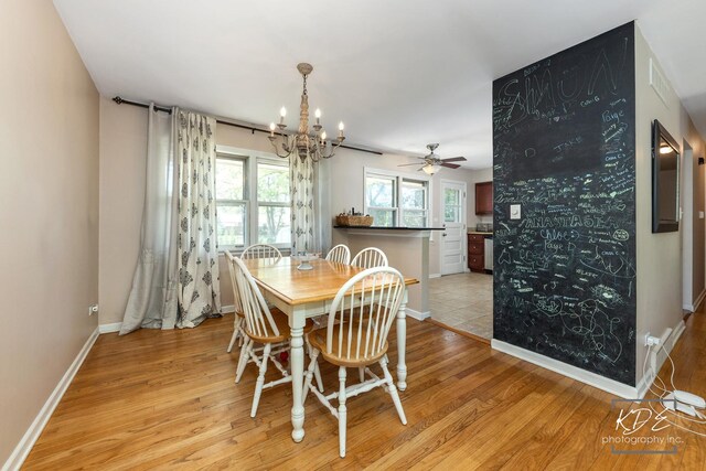 25 Olympus Dr, Naperville, IL 60540 - dining space featuring light wood-style floors, a chandelier, baseboards, and a ceiling fan