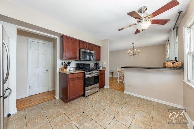 25 Olympus Dr, Naperville, IL 60540 - kitchen with stainless steel appliances, a chandelier, light tile patterned floors, and ceiling fan