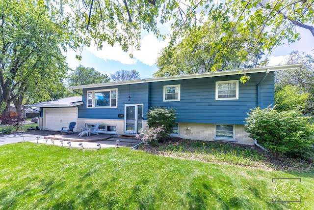 25 Olympus Dr, Naperville, IL 60540 - rear view of property with a lawn, an attached garage, asphalt driveway, and brick siding