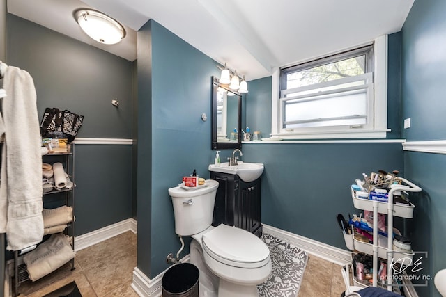 25 Olympus Dr, Naperville, IL 60540 - bathroom with toilet, vanity, baseboards, and tile patterned floors