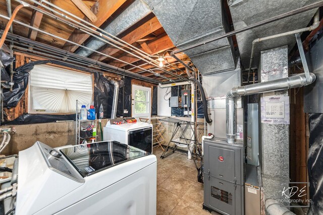 25 Olympus Dr, Naperville, IL 60540 - below grade area featuring washing machine and clothes dryer and tile patterned floors