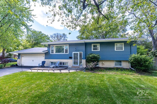 25 Olympus Dr, Naperville, IL 60540 - view of front of home featuring a front yard, asphalt driveway, and an attached garage