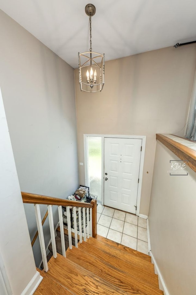 25 Olympus Dr, Naperville, IL 60540 - foyer featuring a chandelier, stairway, light tile patterned flooring, and baseboards