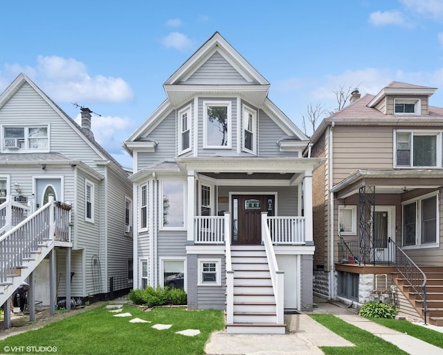 4308 N Whipple St, Chicago, IL 60618 - view of front of home with stairway, a front lawn, and covered porch