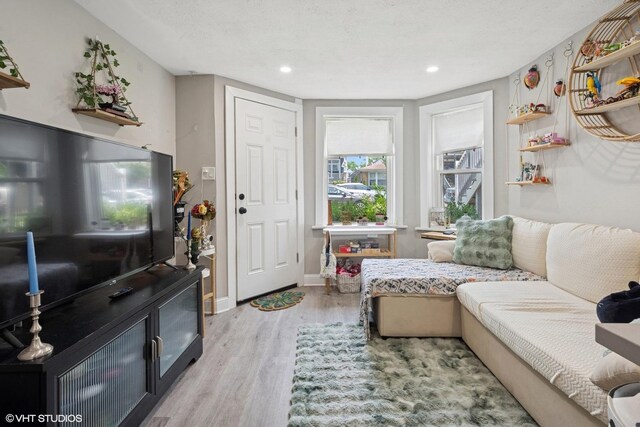 4308 N Whipple St, Chicago, IL 60618 - living room featuring light wood-style flooring, recessed lighting, and baseboards