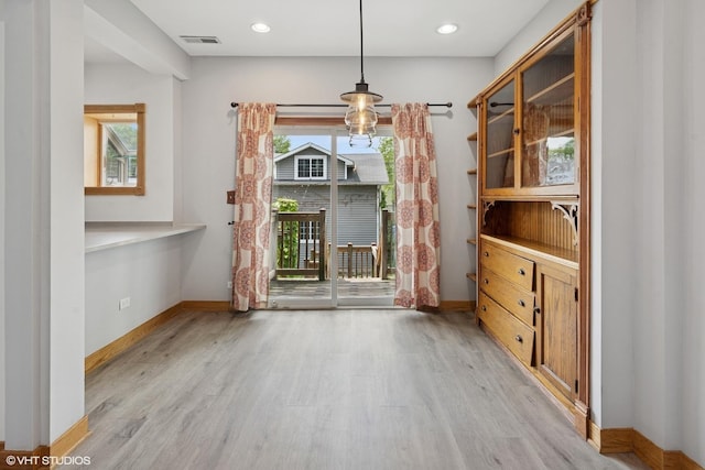 4308 N Whipple St, Chicago, IL 60618 - unfurnished dining area featuring light wood finished floors and baseboards