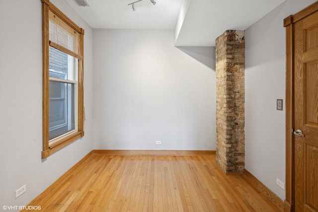 4308 N Whipple St, Chicago, IL 60618 - spare room featuring light wood-style flooring and baseboards