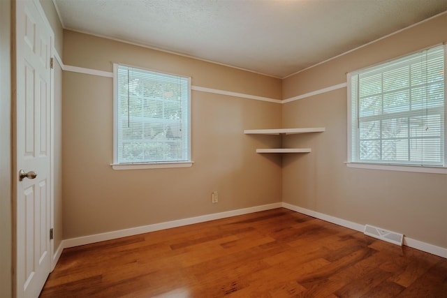20541 E 2050 N Rd, Towanda, IL 61776 - empty room featuring wood finished floors and baseboards