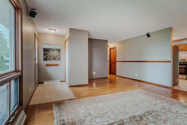 20541 E 2050 N Rd, Towanda, IL 61776 - spare room featuring light wood-style floors and baseboards